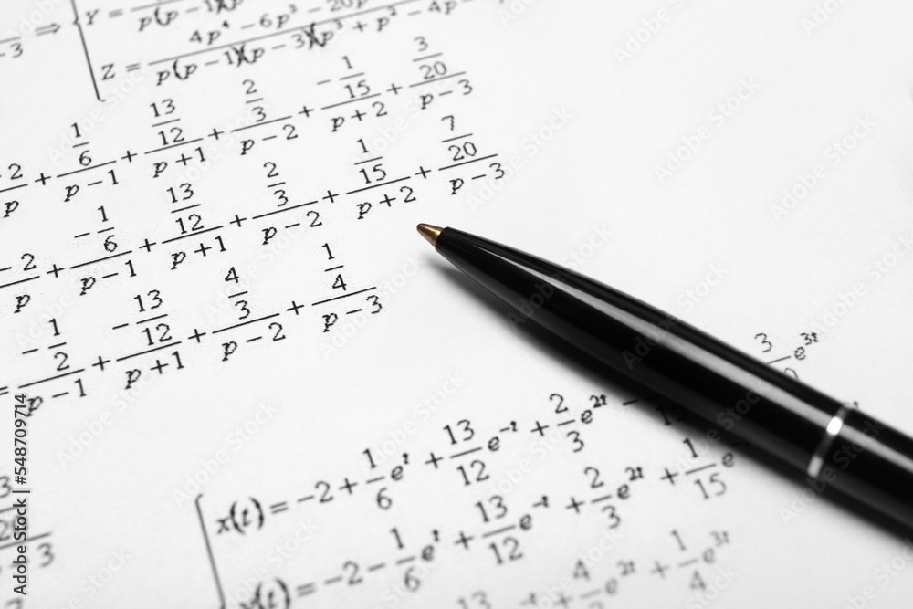 Sheet of paper with mathematical formulas and pen, closeup Sheet of paper with mathematical formulas and pen, closeup