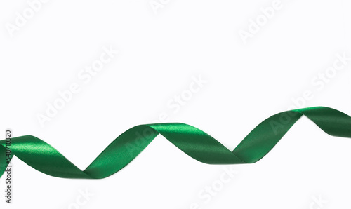 Green curly ribbon isolated on white background.