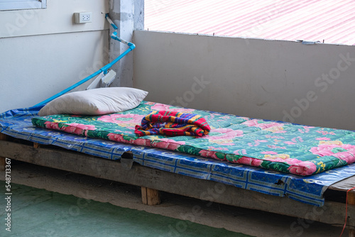Old Bed of a Homeless Man in an Abandoned Building in the City. photo