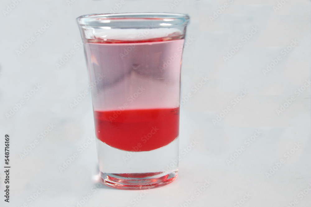 red drink in a small glass that is fresh when drunk, if sold red drink in a small glass that is fresh when drunk, if sold