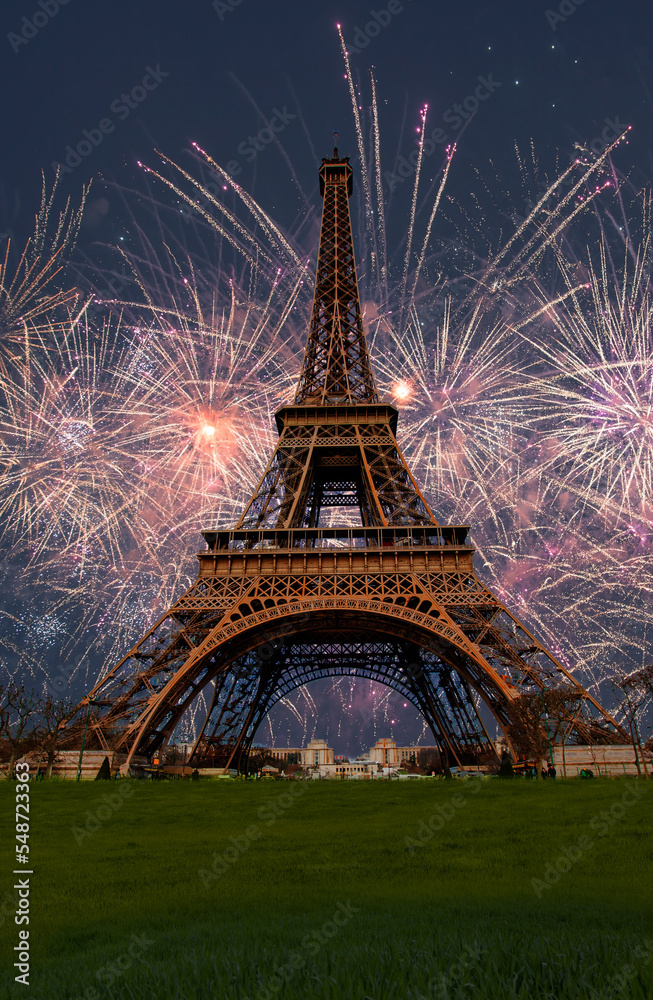 Eiffel tower with fireworks at night  in Paris, France. The Eiffel tower is the most visited touristic attraction in France