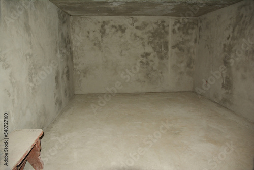 House basement bombproof shelter under construction. House basement plastering walls inside.
