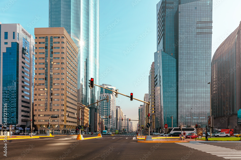 Naklejka premium Abu Dhabi Streets and Skyscrapers. Tall Modern Glass Buildings in Abu Dhabi. United Arab Emirates.