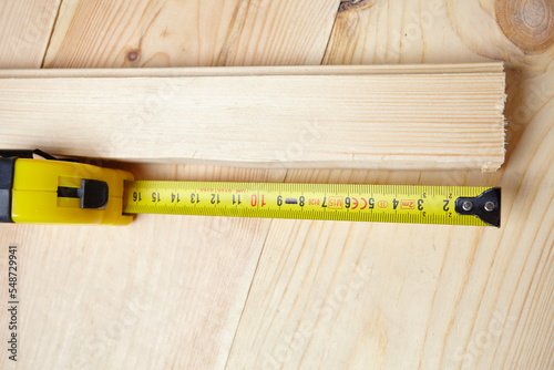 tape measure on the wooden background