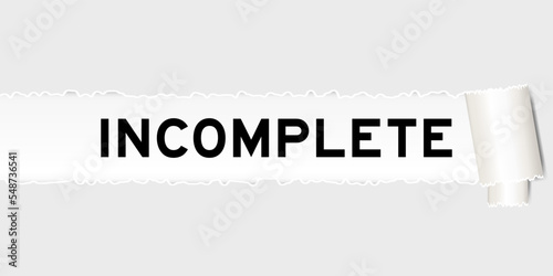 Ripped gray paper background that have word incomplete under torn part