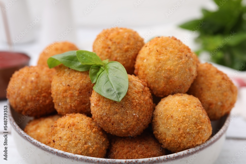 Bowl of delicious fried tofu balls with basil, closeup Bowl of delicious fried tofu balls with basil, closeup