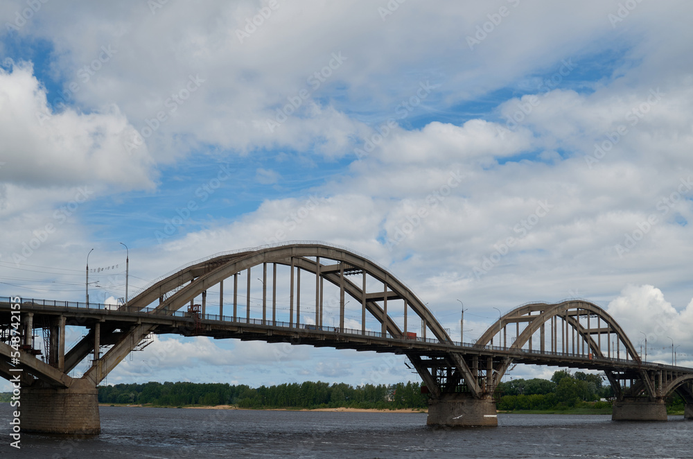 City bridge across the river with metal arches City bridge across the river with metal arches