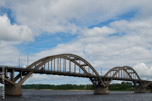 City bridge across the river with metal arches