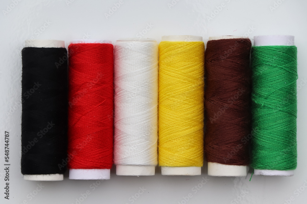 Equipment and sewing threads on white background Equipment and sewing threads on white background