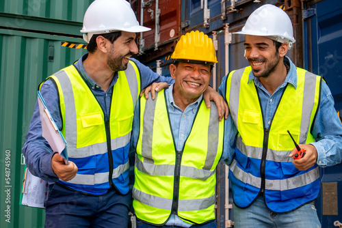 Happy multiethnic professional engineers teamwork smiling and laughing together. Worker team's achievements and happiness at work