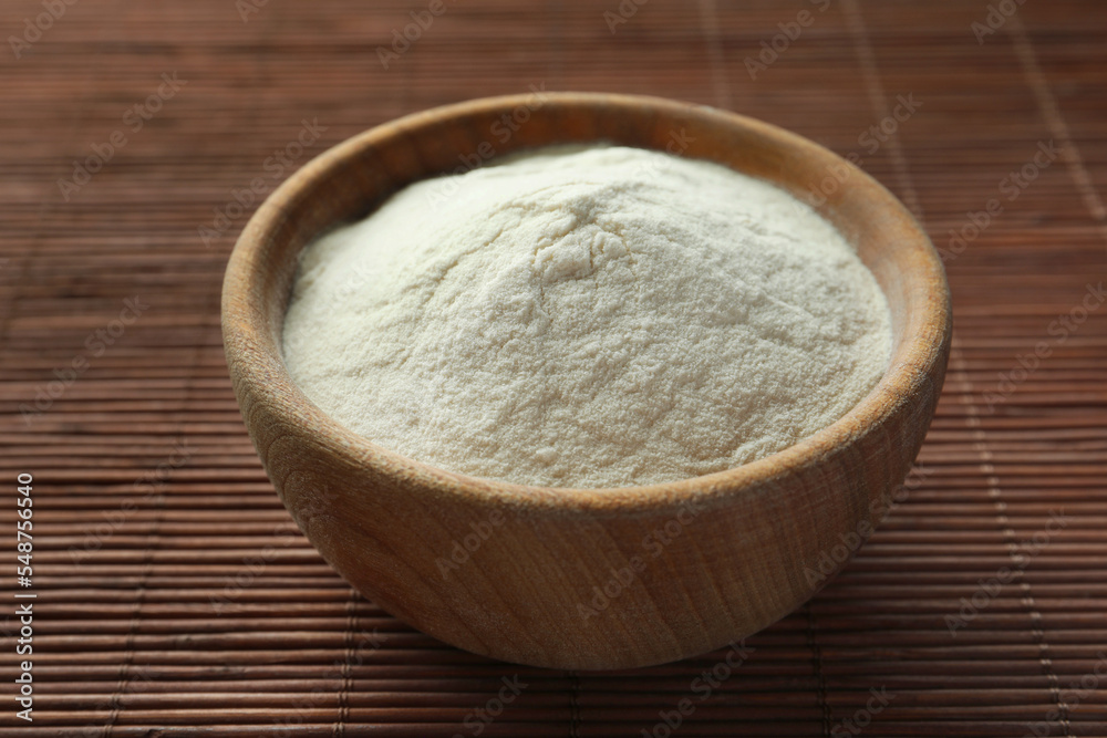 Bowl of agar-agar powder on bamboo mat, closeup Bowl of agar-agar powder on bamboo mat, closeup