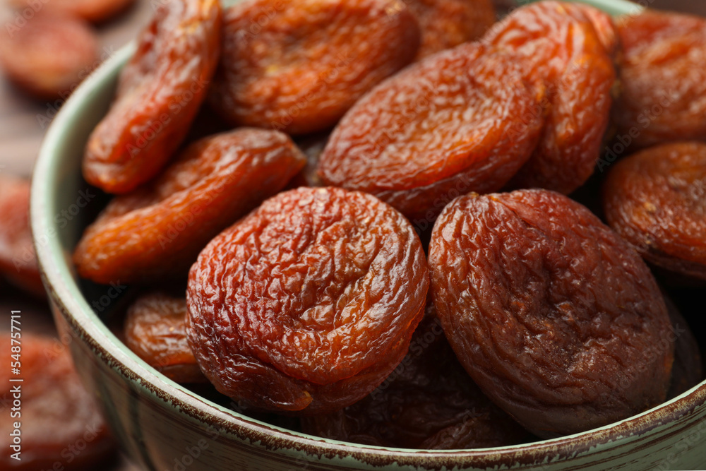 Closeup view of tasty apricots in bowl. Dried fruits Closeup view of tasty apricots in bowl. Dried fruits
