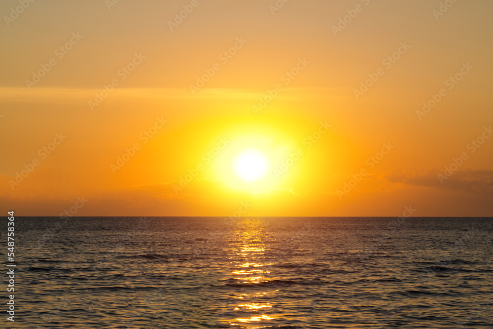 Sea sunset sky. Ocean sunrise. Sunset sky and sun through the clouds over. Meditation ocean and sky background. Tranquil seascape. horizon over the water.