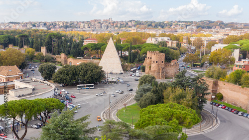 Photography Aerial view of Ostiense square and Pyramid of Cestius, a Roman Era pyramid located in Rome, Italy