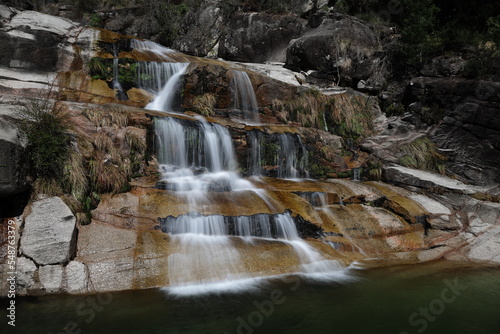 Fototapeta Naklejka Na Ścianę i Meble -  A view of the Cascata Fecha de Barjas waterfalls in the Peneda-Geres National Park in Portugal