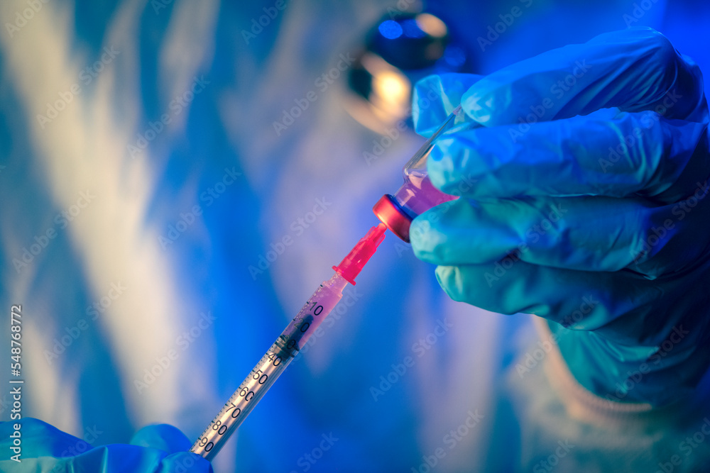 Medical hand glove blue vial vaccine hypodermic needle syringe