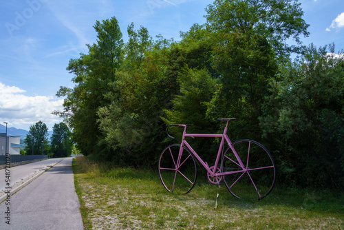Big pink bicycle at Ponte nelle Alpi, Italy