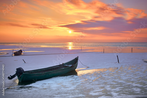 sunrise by boat in winter