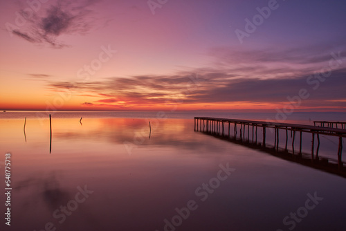 pontoon on the shore of the lake at sunrise 02