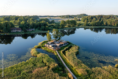 view from above of ancient wooden settlement on river island, recontruction of ancient architecture photo