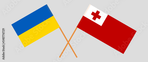Crossed flags of Ukraine and Tonga. Official colors. Correct proportion