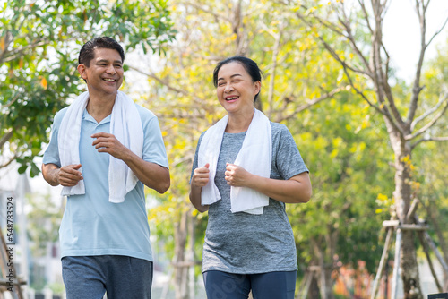 happy couple asian elder jogging running with smile in park