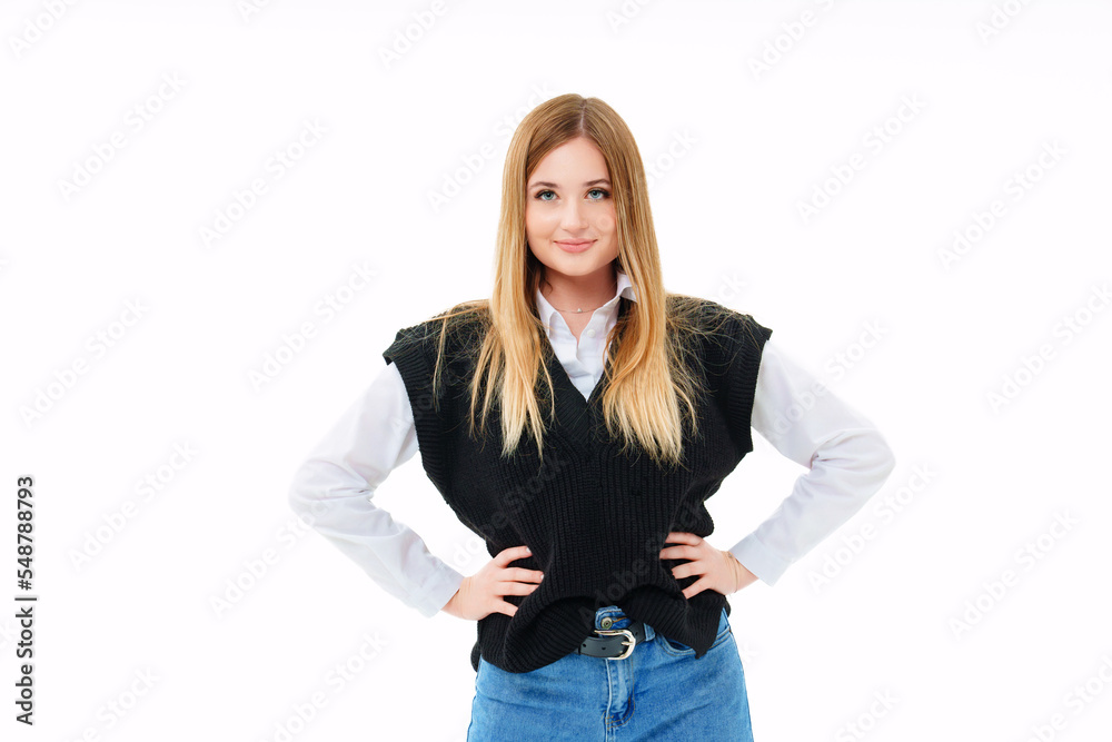 a blonde with sequins on face in a black knitted vest on a white background.