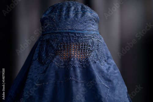 Closeup of Muslim woman in Burka or Burqa, tradition cloths in Afghanistan and West Pakistan, Muslim women wear a burqa covering their face and body photo