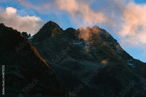 The peaks of Val Camonica with the first snow  glaciers  foliage and autumn colors  near the town of Ponte di Legno  Italy - October 2022.