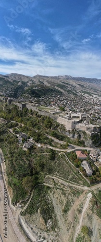 Gjirokaster castle-Clock tower, ottoman architecture in Albania, Unesco World Heritage Site, Gjirocaster ancient town, Albania,Europe, aerial panorama landscape of Gjirokastra UNESCO
 photo