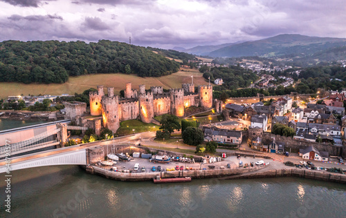 Obraz na płótnie Aerial view with Conwy town and the medieval castle, the famous landmark of Wales and UK, captured at sunset w salonie