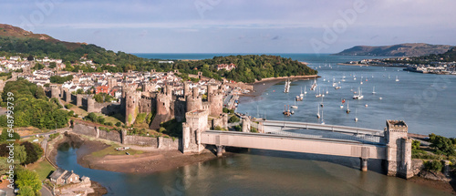 Obraz na płótnie Aerial view with Conwy town and the medieval castle, the famous landmark of Wales and UK, captured in the morning w salonie