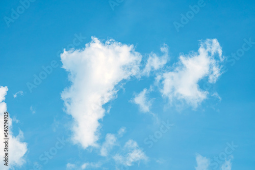 Clouds in the blue sky. Natural sky background texture  beautiful color. Peaceful blue sky with light clouds. The free form beauty of clouds and sky is perfect for background  backdrop and wallpaper.