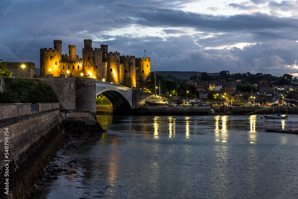 Conwy town and The Castle, the awesome landmark medieval fortress in Wales, UK captured at sunset