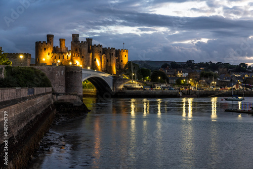 Conwy town and The Castle, the awesome landmark medieval fortress in Wales, UK captured at sunset