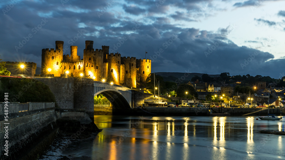 Conwy town and The Castle, the awesome landmark medieval fortress in Wales, UK captured at sunset Conwy town and The Castle, the awesome landmark medieval fortress in Wales, UK captured at sunset