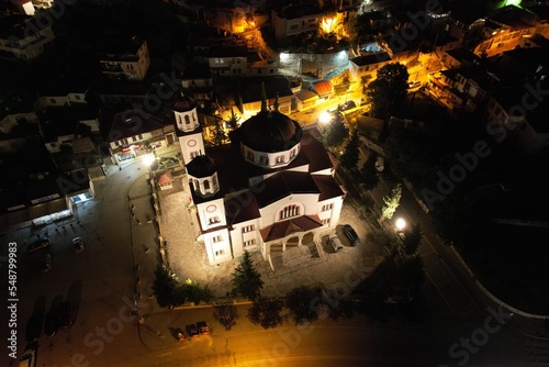 Berat is a city on the Osum River, known for its white Ottoman houses and castle on the hill, aerial night view of this historical city,Albania,Europe photo