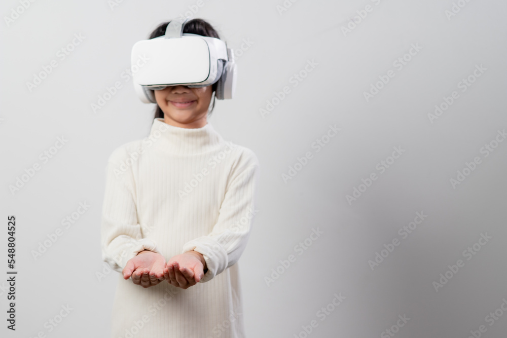 Asian little girl with virtual reality headset. Innovation technology and education concept Asian little girl with virtual reality headset. Innovation technology and education concept