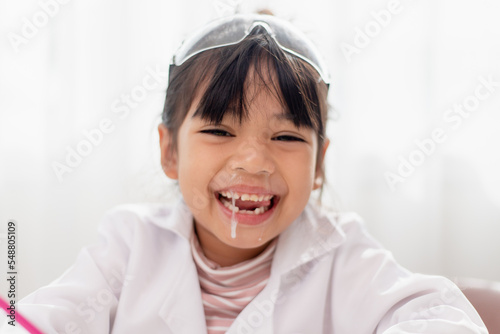 Photography little Asian girl. child has a runny nose with clear snot,virus
