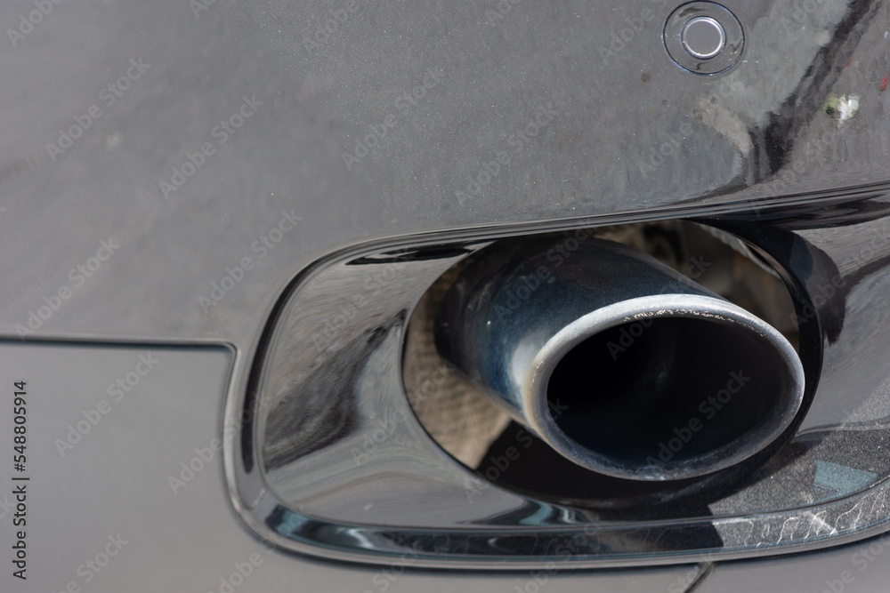 Close up to an exhaust pipe muffler