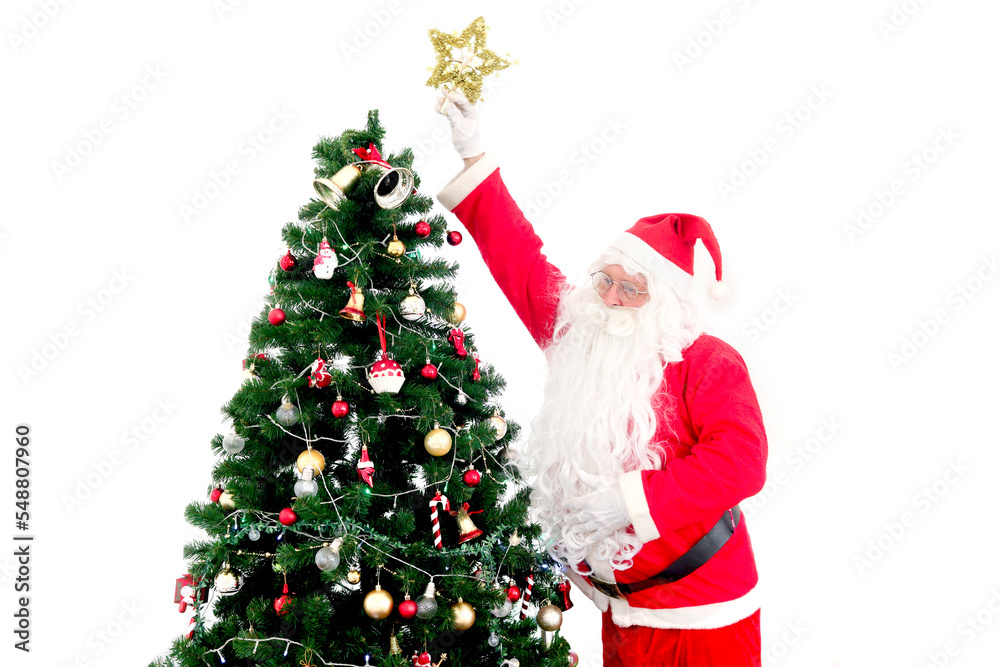 Santa Claus reaching hand up to the top of a Christmas tree for decorating Christmas tree with a star, Merry Christmas happy winter holiday celebration Santa Claus reaching hand up to the top of a Christmas tree for decorating Christmas tree with a star, Merry Christmas happy winter holiday celebration
