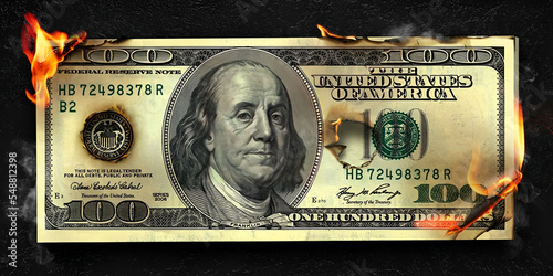Dollar bill on fire burning 100 dollar photo