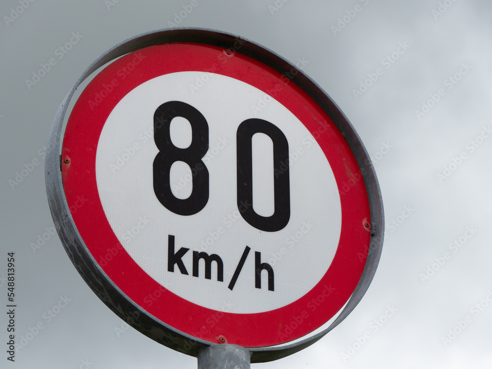 Round sign limiting speed, sky. Signs warning of a maximum speed of 80 km h Round sign limiting speed, sky. Signs warning of a maximum speed of 80 km h
