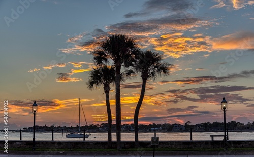 Sunrise and clouds on the sky above Saint Augustine in Florida, and boats on the Matanzas river photo
