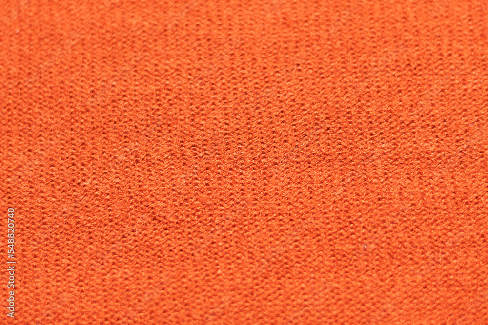 closeup to a textured orange rough fabric closeup to a textured orange rough fabric