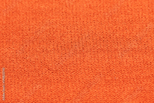 closeup to a textured orange rough fabric © Andres Serna