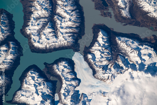 Aerial view of Perito Moreno Glacier in Argentina. Snow capped mountains and vibrant blue lakes. Digitally enhanced. The elements of this image furnished by NASA.