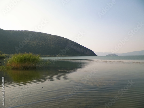 Coast of Lake Prespa and Mountains of Galicica National Park.