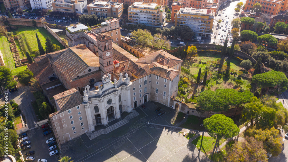 Fototapeta premium Aerial view of Basilica of the Holy Cross in Jerusalem, a Catholic Minor basilica in Rome, Italy. It is one of the Seven Pilgrim Churches of the city.