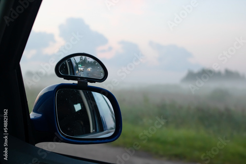 Side mirror of the car at sunset nature